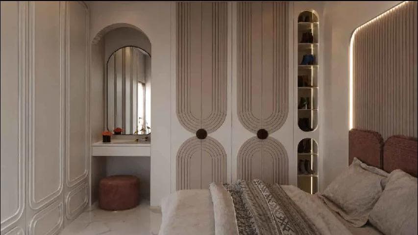 Bedroom dressing nook with arched mirror beside wardrobe, Sambhav Dua residence